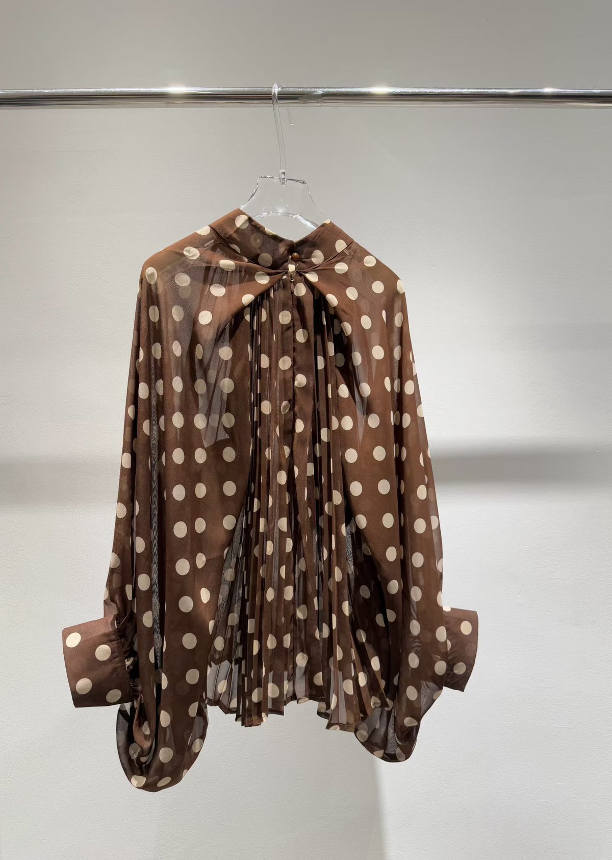 Brown polka dot blouse back view