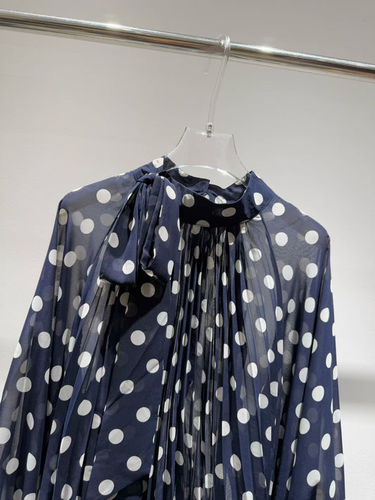 Navy blue polka dot blouse with shoulder bow