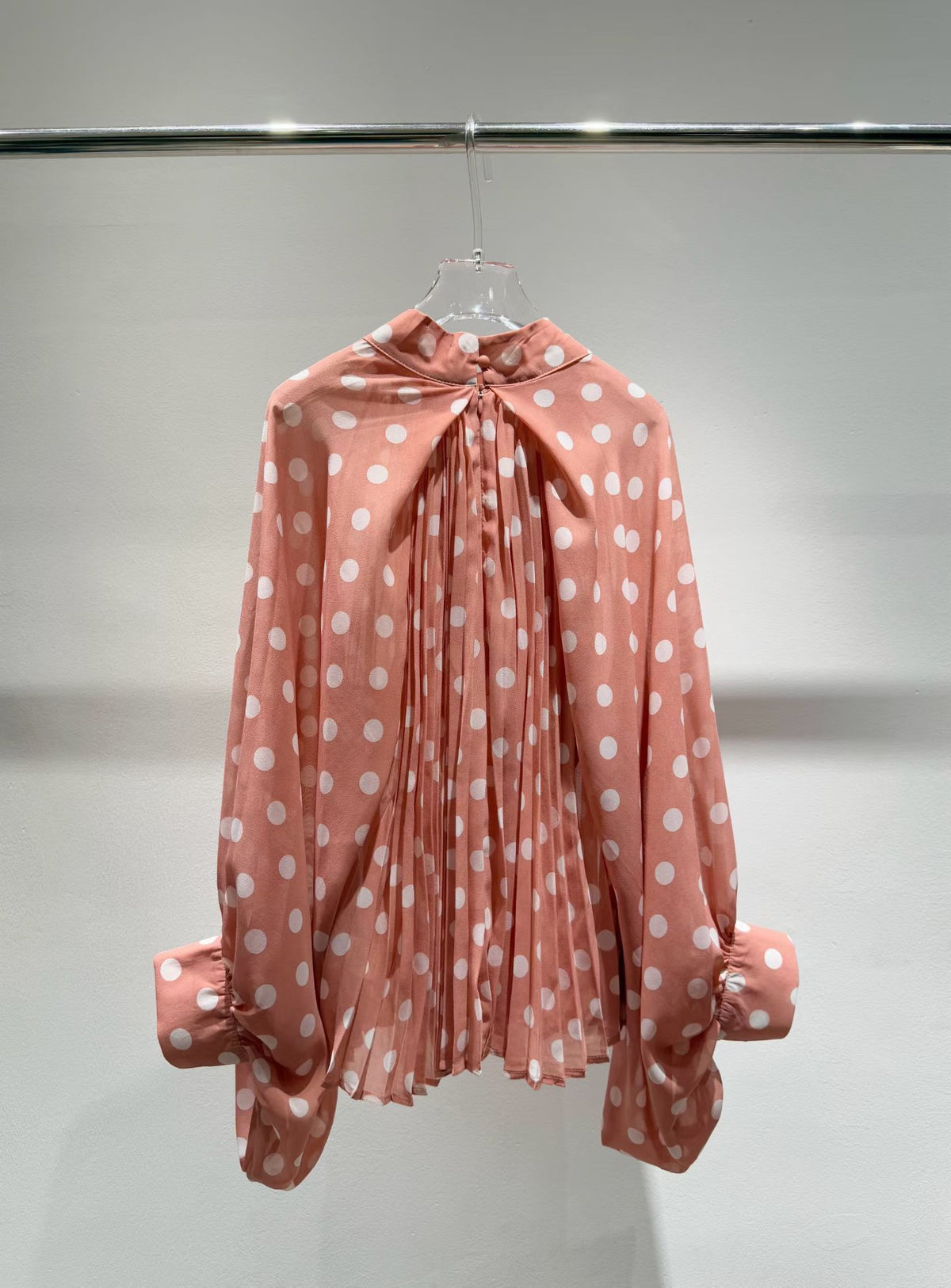 Pink polka dot blouse back view