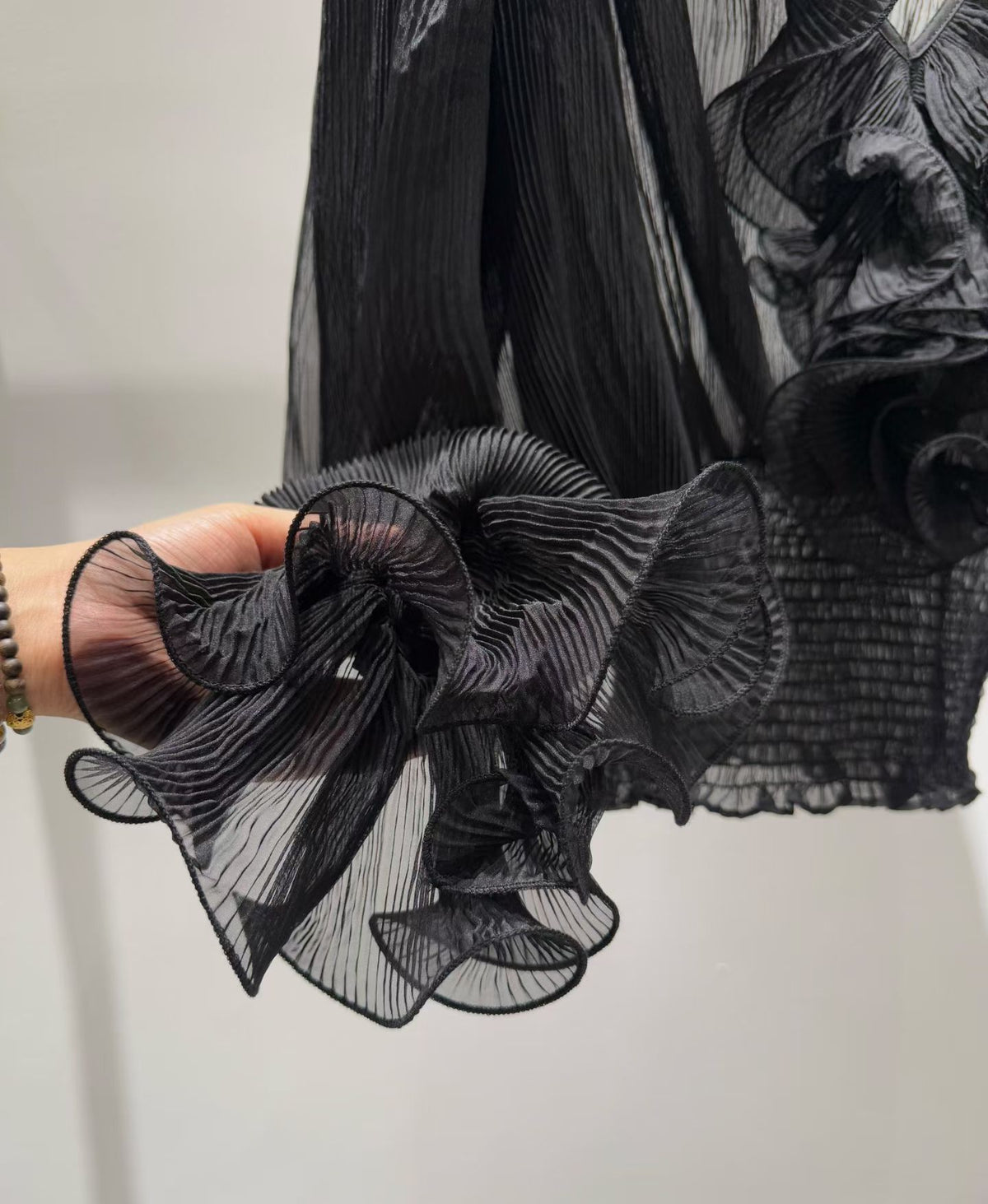 Black blouse ruffle detail