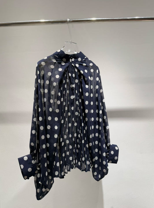 Navy blue polka dot blouse back view