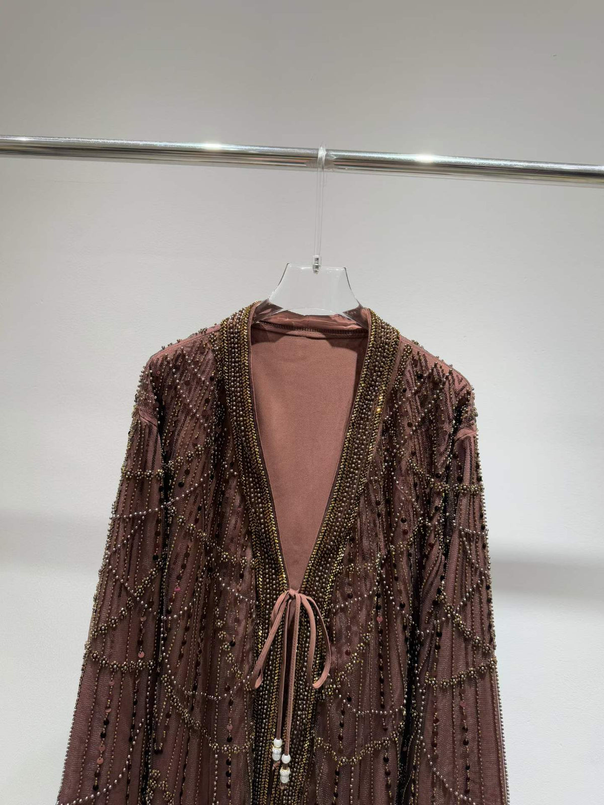 Brown jacket neckline and tie-front detail