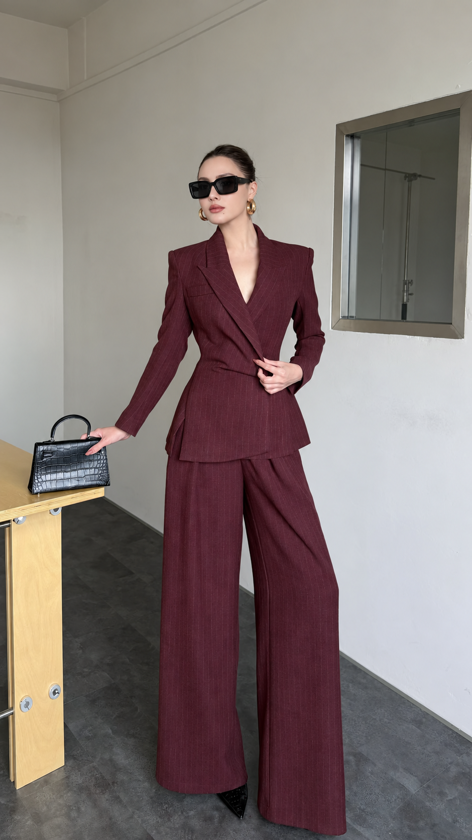 Burgundy pinstripe blazer and wide-leg trouser suit front view with notched lapels
