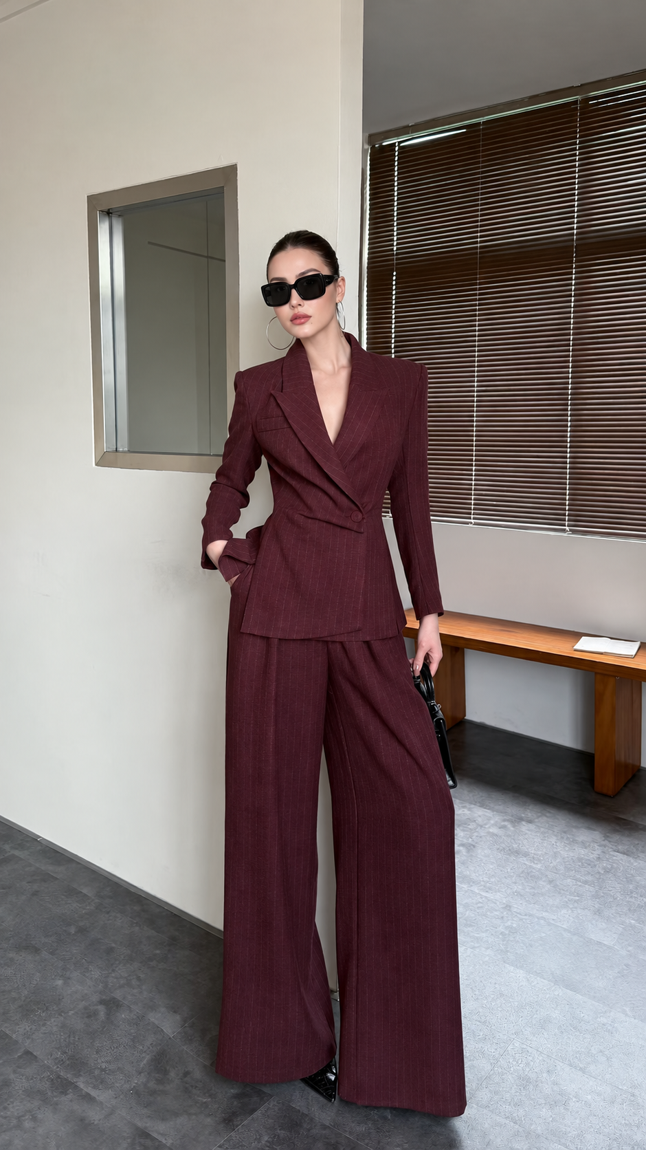 Burgundy pinstripe blazer and wide-leg trouser suit shown from the front