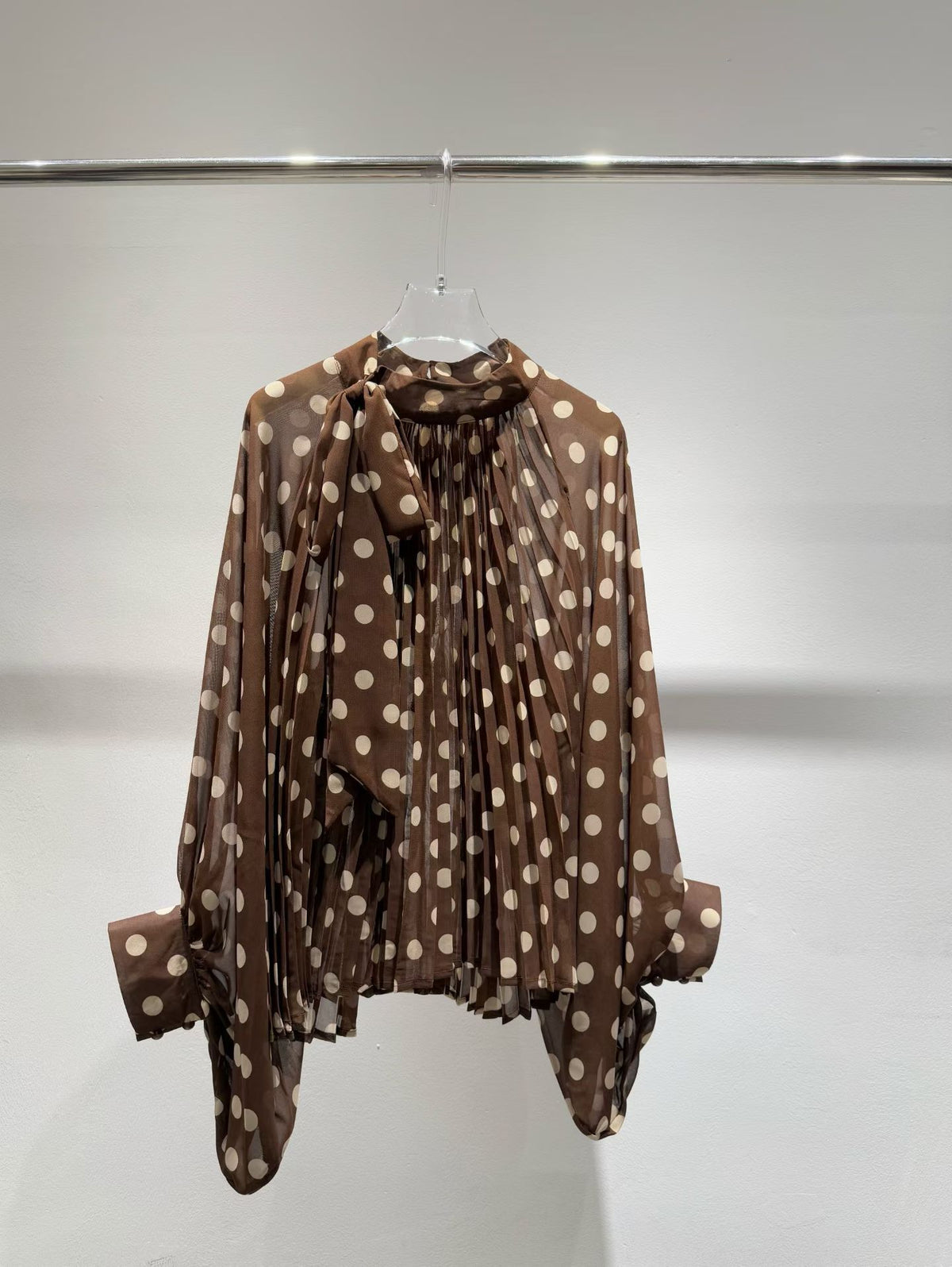 Brown polka dot blouse front view