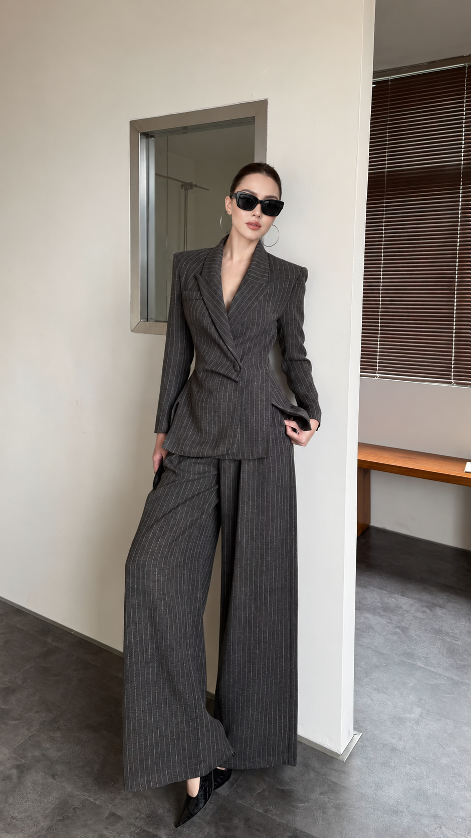 Charcoal pinstripe blazer and wide-leg trouser suit front view with lapels and wide-leg trousers