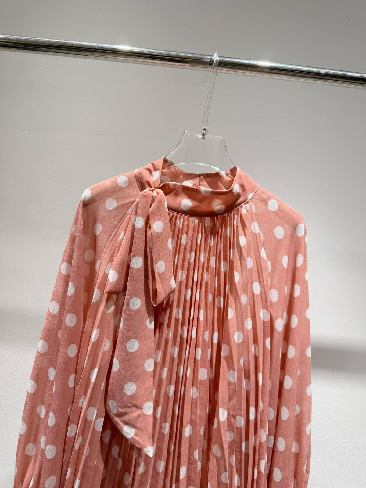 Pink polka dot blouse detail
