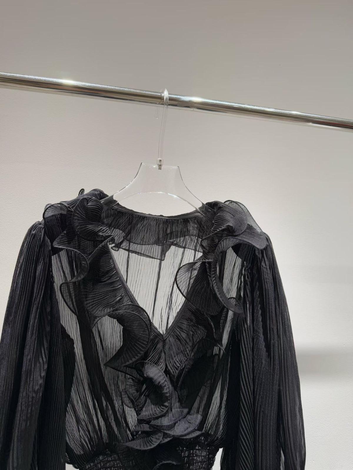 Black blouse neckline and ruffle detail