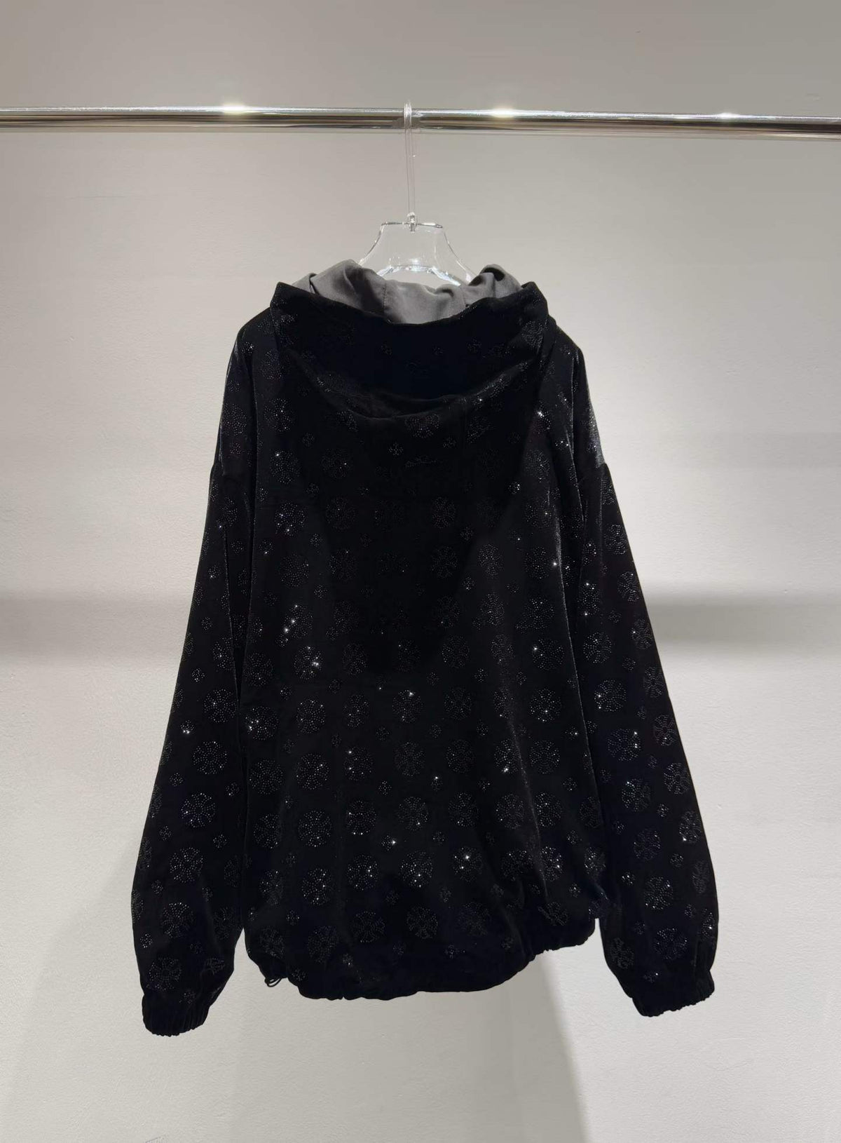 Black floral sparkle hooded zip-front jacket, back