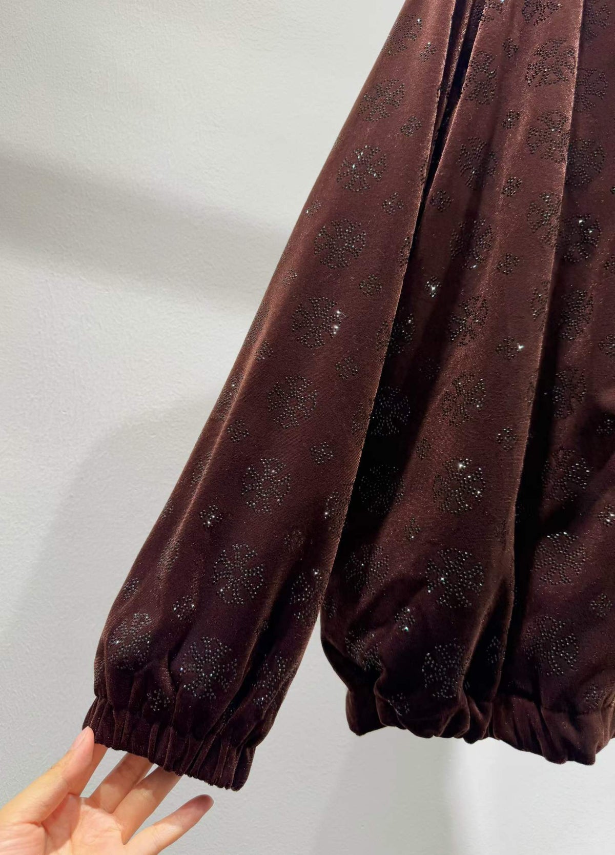 Brown floral sparkle hooded zip-front jacket, cuff detail