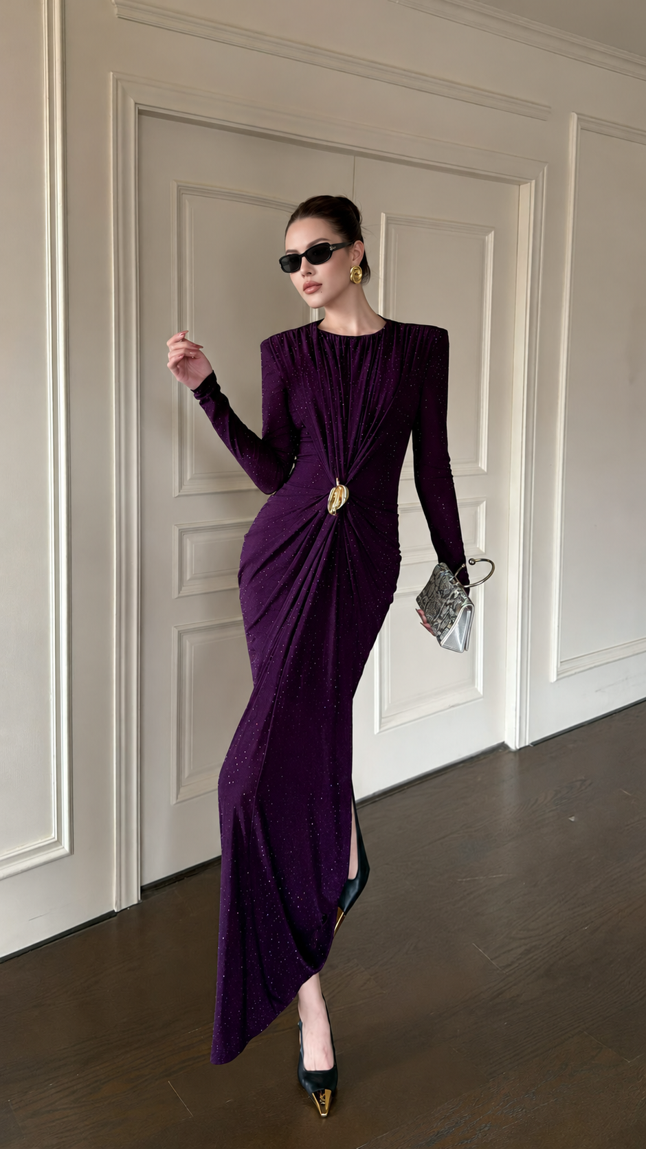 Plum ruched maxi dress with a gold-tone waist accent, angled front view