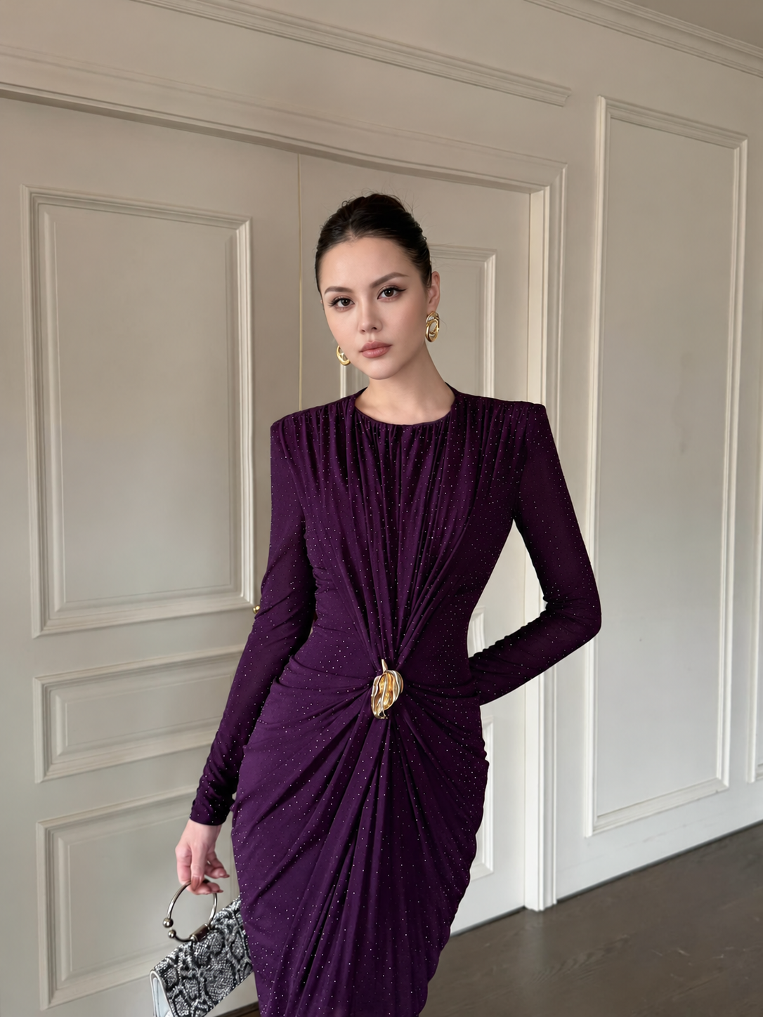 Plum long-sleeve ruched maxi dress with a gold-tone waist accent, front view