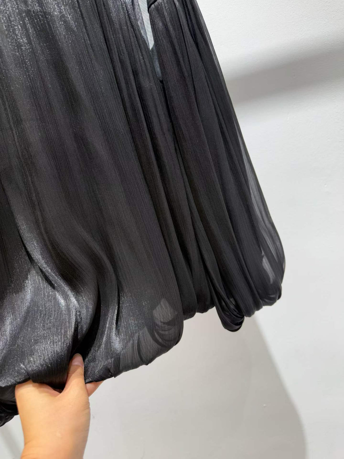Black blouse gathered bubble hem detail