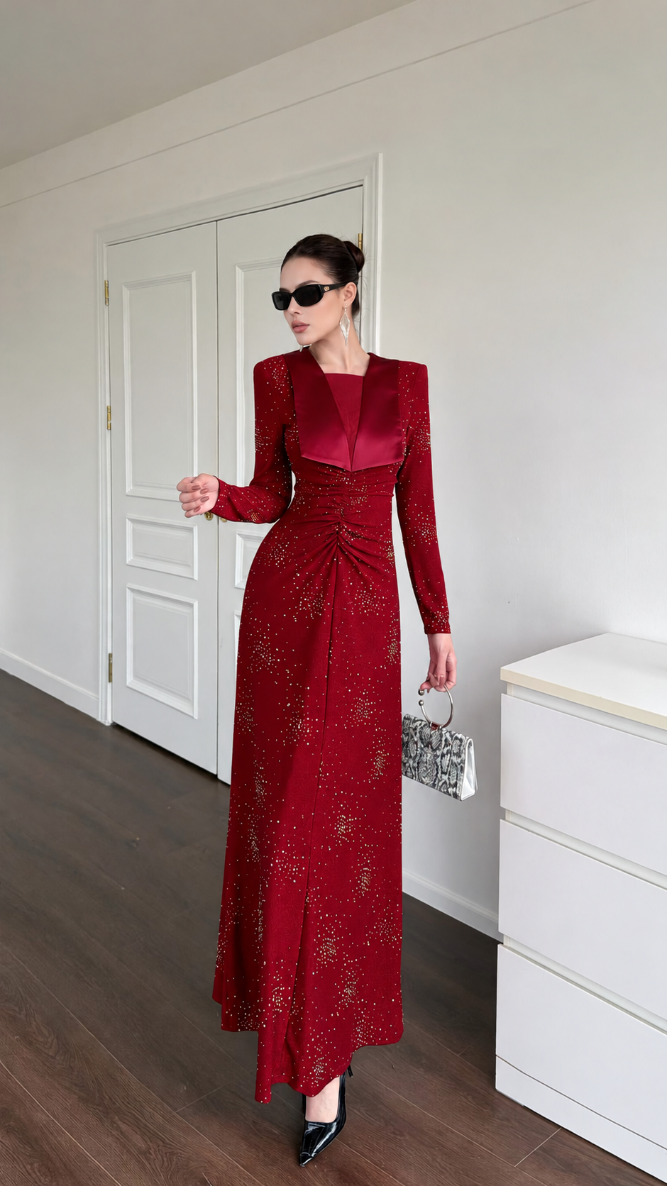 Front full-length view of the burgundy embellished maxi dress with a ruched centre front.