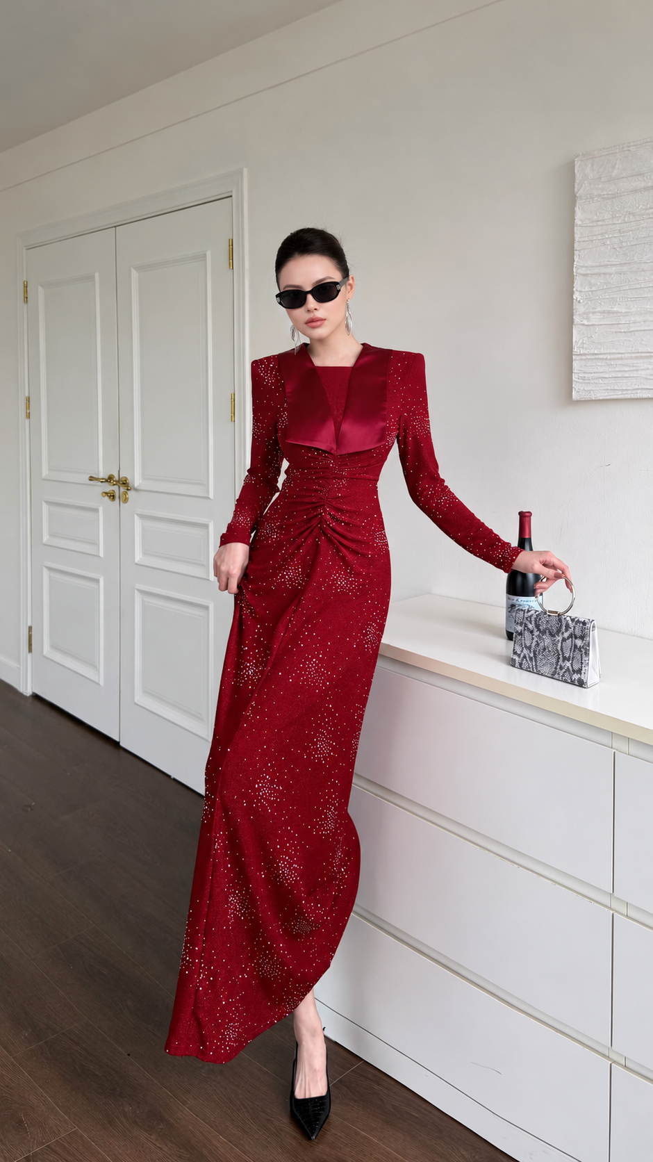 Burgundy ruched maxi dress in motion, highlighting its full-length skirt and sparkling finish.